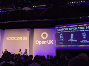 Purple screens saying SOOCon24 Open:UK, below screens are speakers Peter Zaitsev, Stephen Augustus, Liz Rice.